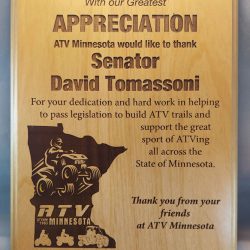 Wooden appreciation plaque thanking Senator David Tomassoni for supporting ATV trails and ATVing in Minnesota.