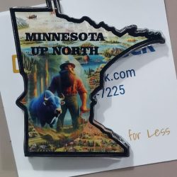 Magnet shaped like Minnesota with "MINNESOTA UP NORTH," Paul Bunyan, and a blue ox on a background illustration.