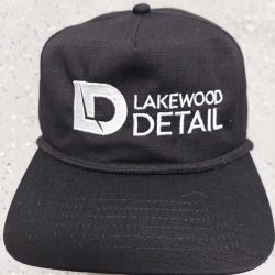 A black cap with the "Lakewood Detail" logo embroidered in white on the front.
